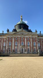 Facade of historic new palais against clear blue sky