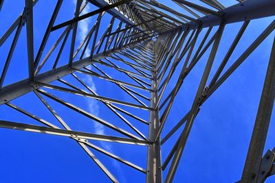 Low angle view of bridge against blue sky