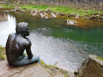 Man swimming in water