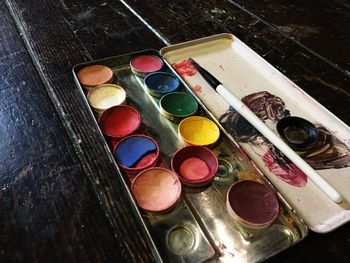 High angle view of paintbrushes in container