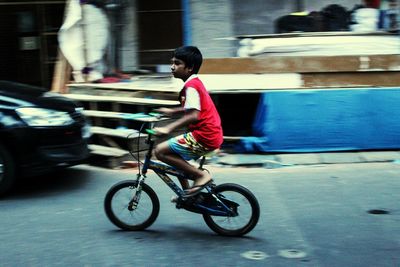 Man riding bicycle on street