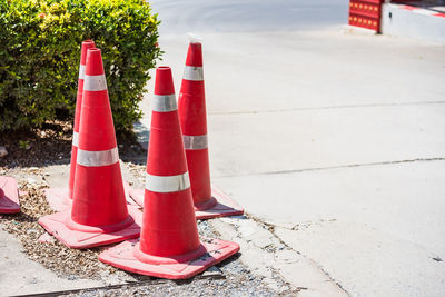 Road sign on sidewalk by street