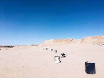 Sand dune in desert against clear blue sky