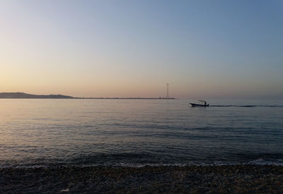 Scenic view of sea against clear sky during sunset