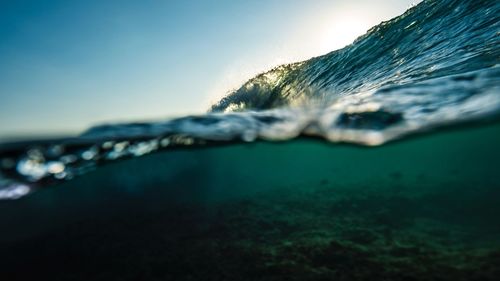 Close-up of water flowing over sea