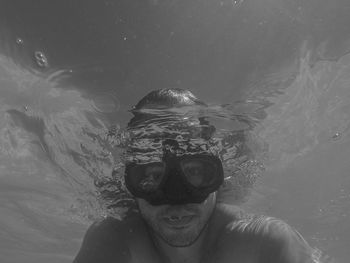 Portrait of man swimming in sea