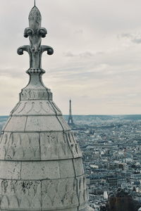 Statue of liberty against sky in city