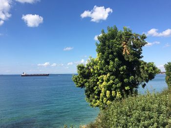 Scenic view of sea against cloudy sky