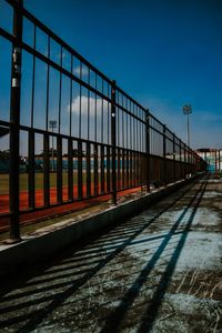Train at railroad station platform against sky