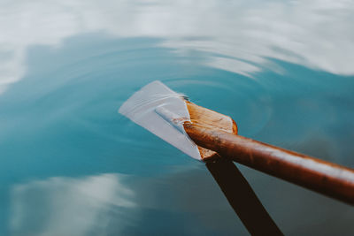 Close-up of boat in lake against sky