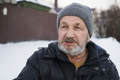 Portrait of man in snow