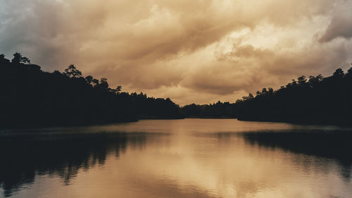 Scenic view of lake against sky during sunset