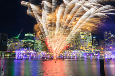 Fireworks display. sydney darling harbour fireworks with modern business district architecture