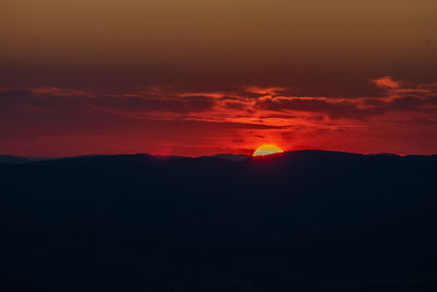 Scenic view of dramatic sky during sunset