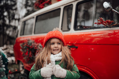 Portrait of smiling young woman in car