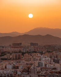 A beautiful sunset overlooking malaga and the mountain ranges 