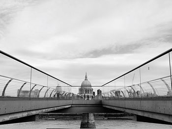 Bridge and historic building against sky