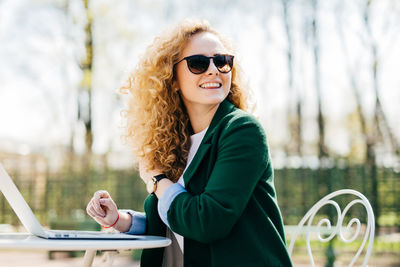 Portrait of young woman in sunglasses