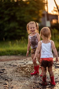 Full length of children on road