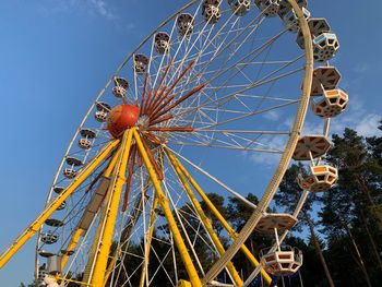 Low angle view of ferris wheel against sky