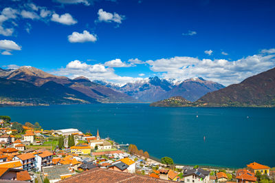 View of lake como, looking north, from musso, with alps, villages and the mountains of valtellina.