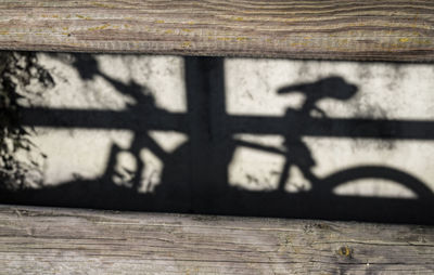 Shadow of bicycle on wall