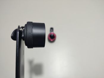 Close-up of camera against black background