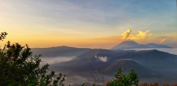 Scenic view of mountains against sky during sunset