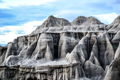 Scenic view of mountains against cloudy sky