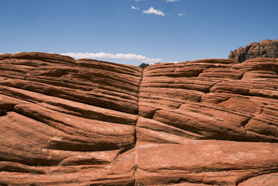 Rock formations on landscape against sky