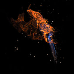 Close-up of fire against black background