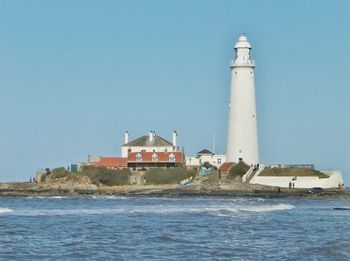 Lighthouse against clear blue sky