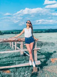 Woman on sunglasses against sky