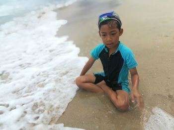 Full length of boy on beach