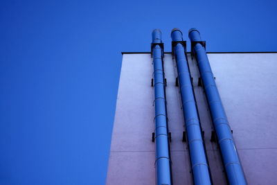 Low angle view of smoke stack against sky