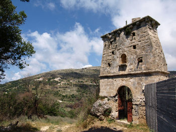 Low angle view of old building against sky