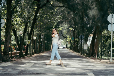 Woman walking on zebra crossing