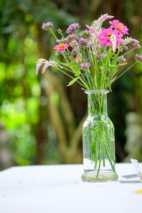 Close-up of pink flower vase on table