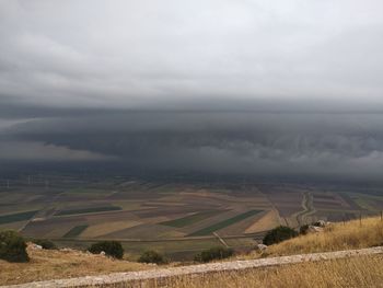 Scenic view of agricultural field against sky