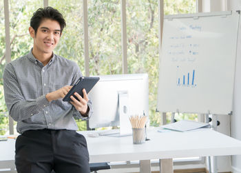 Young man using laptop on table