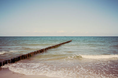 View of beach against clear sky