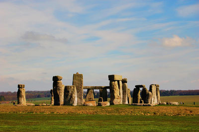 Old ruins on landscape against sky