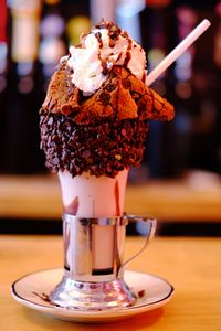 Close-up of ice cream in glass on table