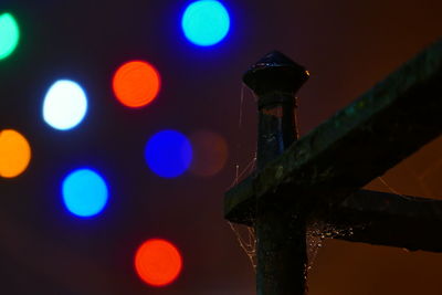 Low angle view of illuminated lights at night