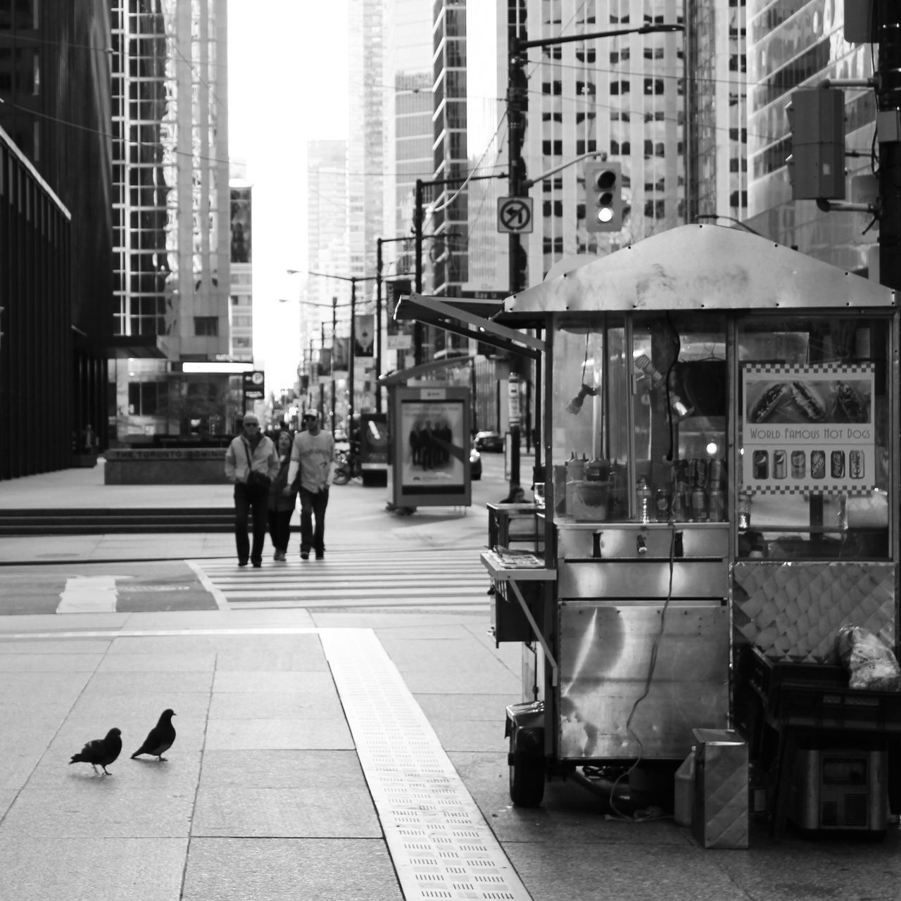 building exterior, architecture, city, built structure, men, city life, walking, person, street, full length, lifestyles, building, office building, modern, medium group of people, transportation, rear view, day, incidental people