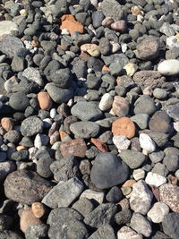 High angle view of stones on pebbles