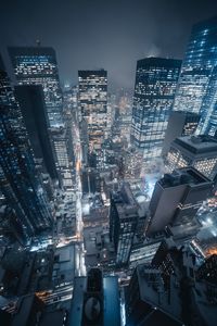 Aerial view of city lit up at night