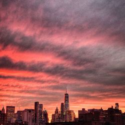 Cityscape against cloudy sky