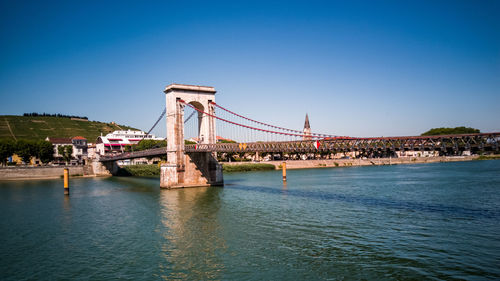 View of bridge over sea against clear sky