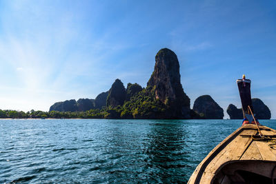 Scenic view of sea and mountains against sky